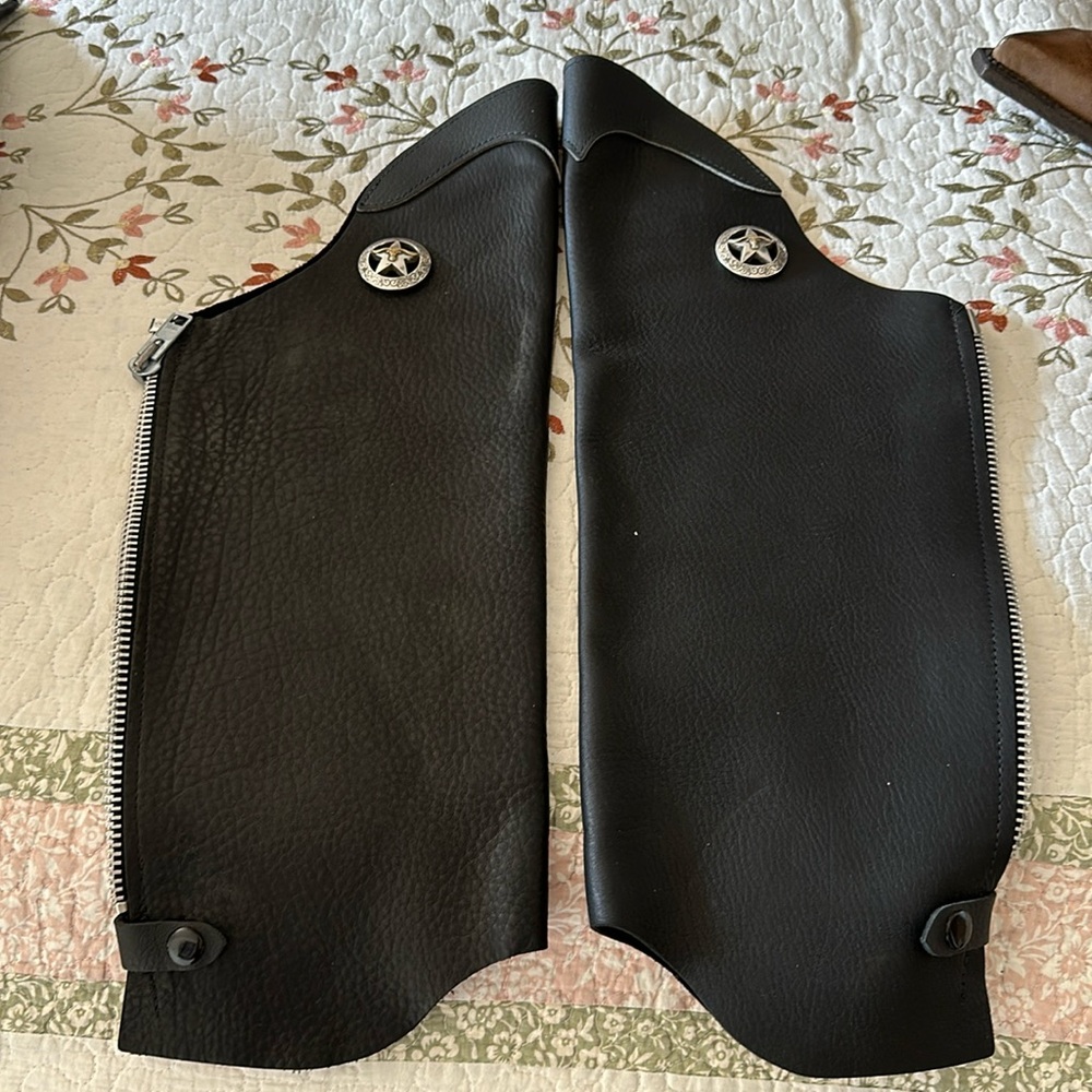 Leather chaps. Leather legs